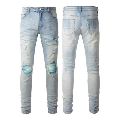 China Punkstijl Mensen gescheurde magere midden taille blauwe denim vintage gewassen strek Te koop