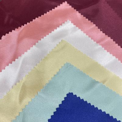 China 50D Waterproof Customized Bright Satin TPM Twist BR Fabric For Dress And Skirt for sale