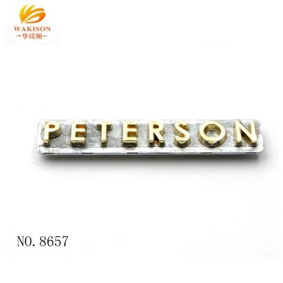 China Bag Mini Metal Letters Metal Brand Logo Label for Handbag Fillings for sale