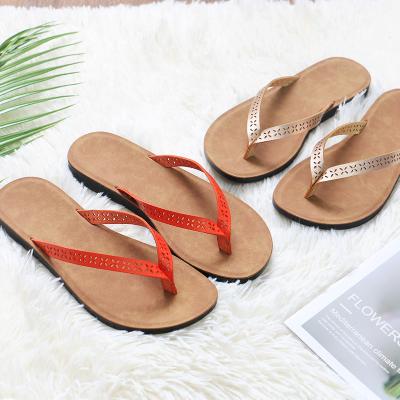 China Pigskin Flip Flop Beach Slippers Fashion Hollow Clip Women's Flat Bottom Summer New Shoes for sale