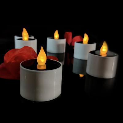 China Tea Light Solar Sensitive Flameless LED Candle Waterproof Yellow Flashing Light For Home Decoration for sale