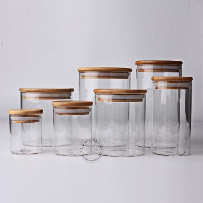 China Cream High Quality Brorosilicate Glass Bottle With Bamboo Lid Customized Food Storage Glass Jar for sale