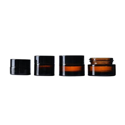 China 30g 50g cosmetic empty amber glass cream jars with black lid cosmetic glass jars for cream package for sale