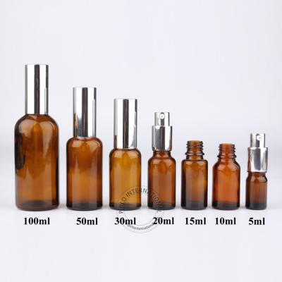 China Personal Care 15ml 20ml Personal Care Serum Cosmetic Packaging Glass Bottle Small Essential Oil Amber Bottle With Silver Metal Cap for sale