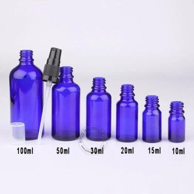 China Cosmetic glass cosmetic pump bottles blue glass bottle essential oil glass bottle for sale