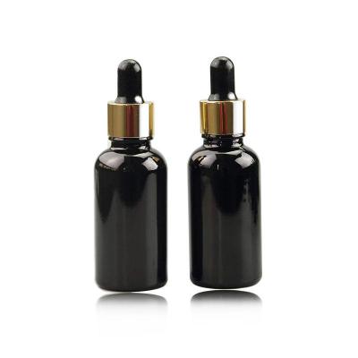 China Black 50ml Cosmetic Glass Dropper Bottle With 18/410 Glossy Glod Dropper for sale