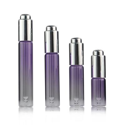 China 10ml 15ml 20ml 25ml Eco-friendly Recyclable Purple Tube Glass Essence Oil Dropper Bottles Squeeze Style Skin Care Oil Dropper Bottles for sale