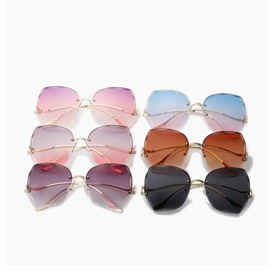 China Korean version of the 2022 fashion sunglasses custom metal irregular sunglasses trend wear ladies rimless Diamond-cut sunglasses retro for sale