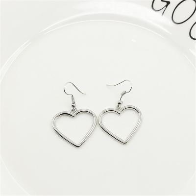 China Simple design silver color hollow heart drop earrings for women new brand fashion ear cuff piercing to dangle earring gift heart for sale