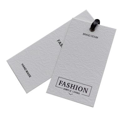 China Apparel Customization Brand Fashion Design Cardboard Embossing Wallpaper Hang Tags T-shirt Hang Tags For Clothes for sale