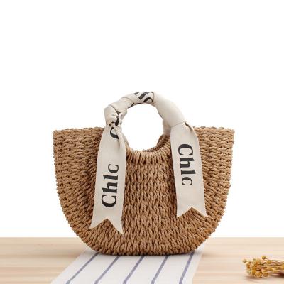 China Custom Logo Accepted Silk Scarf Travel Holiday Bag with Portable Straw Woven Material for sale