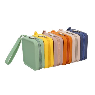 China Customized Color Silicone Travel Cosmetic Bag Fashion Hand Bags for Women's Toiletries for sale