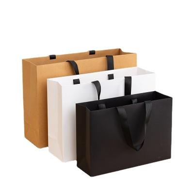 China Custom Printed Paper Bags Cardboard Luxury White Kraft Paper Gift Bag for Shopping Bag for sale