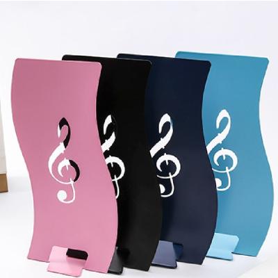 China Organizer Set Metal Bookends Shaped Bookends Desktop Book Storage Musical Note Hollow Stop Book Storage 2 for sale