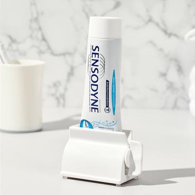 China Sustainable Universal Toothpaste Extrusion Seat Vertical Rack For Facial Cleanser for sale