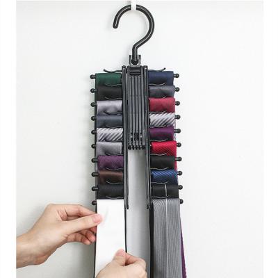 China Contemporary Creative Plastic Hanger Tie Rack Plastic Bow Stretch Multi Functional Clothes Towel Head Band Hanger for sale