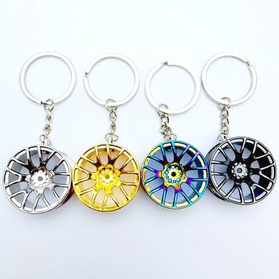 China Factory Made Plastic Car Wheel Keychains Mini Car Rim Key Chains Metal Car Wheel Key Chains for sale