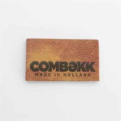 China Sustainable Custom Embossed Patch Leather Jeans Leather Label And Tags For Clothing for sale