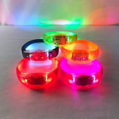 China Barber Shop Wholesale OEM Colorful Custom LOGO DMX Sensor Silicone LED Wristband Programmable Radio Remote Control Wristband for Events for sale