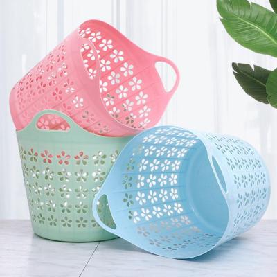 China 21206 Minimalist Laundry Basket Plastic Cheap Pierced Household Goods Handheld Basket for sale