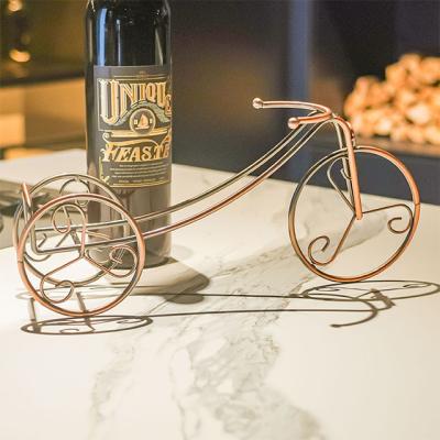 China Sustainable Luxury Single Bottle Metal Wine Rack Stand With Gold Car Bronze Plating Process Shape for sale