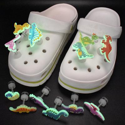 China Soft PVC Shoe Charms Dinosaur Fluorescence PVC Selena Oes Glitter Shoe Charms Glowing in Dark Shoe Decorations Luminous Ornament for sale