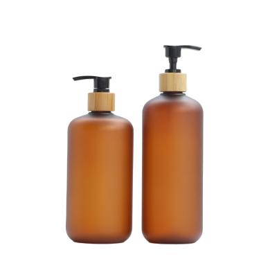 China Cosmetic Packaging Factory Direct PET 120ml Amber Shampoo Bottle With Bamboo Cover Liquid Lotion Pump for sale