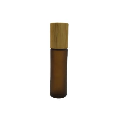 China Factory direct refillable 10ml glass roll on frosted roll on amber roll on bottle with bamboo lid for essential oil for sale