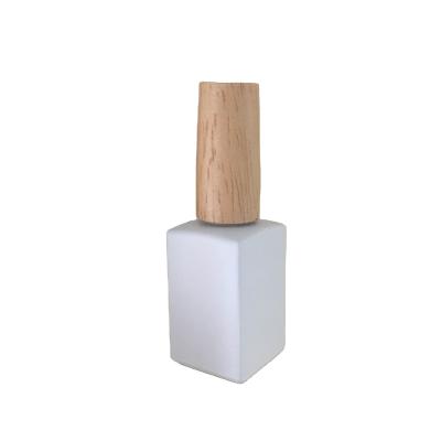 China 5ml 10ml Cosmetic Natural Wood Nail Polish Glass Bottle With Beech Wood Cap And Brush for sale