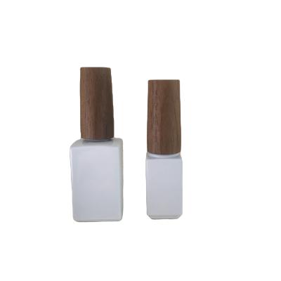 China Cosmetic Customized Natural Elegant Dark Walnut Lid 5ml 10ml Nail Polish Glass Bottle With Brush And Wooden Lid For Nail Care Set for sale