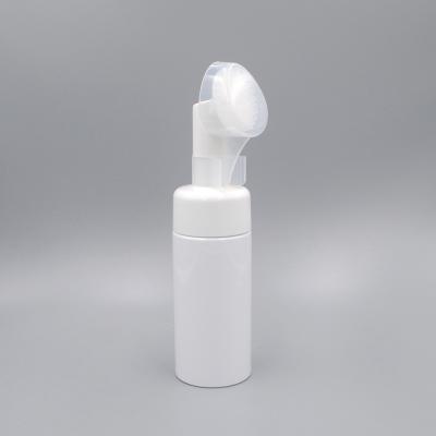 China 100 ml Empty Plastic Cleansing Foam Pump Dispenser Bottle with Silicone Brush for sale