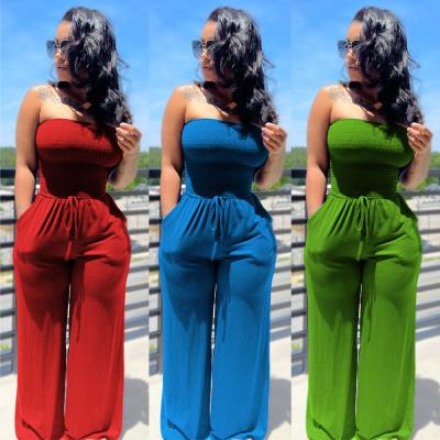 China Women's Clothing 2021 Solid Color Breathable Casual Pleated Strapless Overalls Plus Size Flare Pants Rompers For Ladies for sale