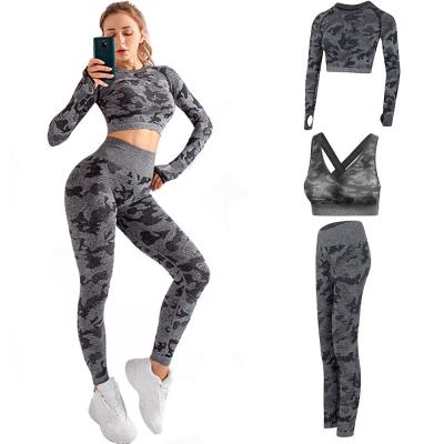 China 2021 OEM Logo Women Set Long Sleeve Yoga Set Breathable Hollow Back Crop Top And Yoga Gaiters Bra Set Seamless Camouflage 3 Pcs Sports Suits for sale