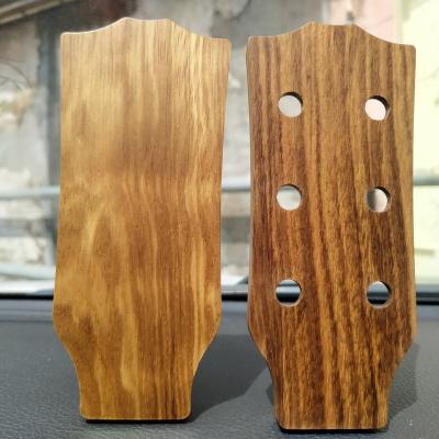 China Play and sing string instruments such as guitar/bass/ukulele factory direct selling can be customized new design shovel guitar pick solid wood bass box for sale