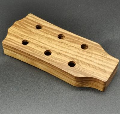 China Play and sing string instruments such as guitar/bass/ukulele factory direct selling can be customized new design shovel guitar pick solid wood box for sale