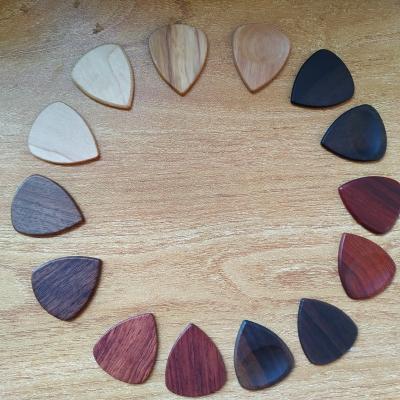 China Plucking string instruments factory direct selling Amazon guitar pick wooden accessories can be customized logo and pattern for sale