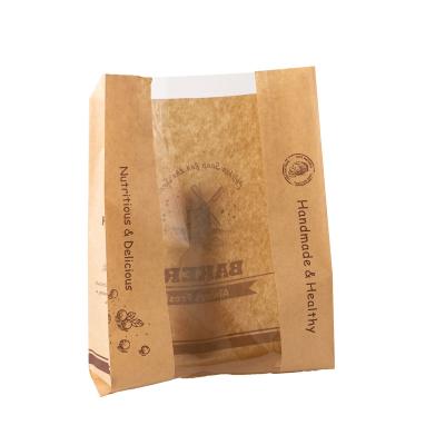 China Handmade Biodegradable recycled customized stand up pouches dry food packaging brown kraft paper bags with translucent window for sale