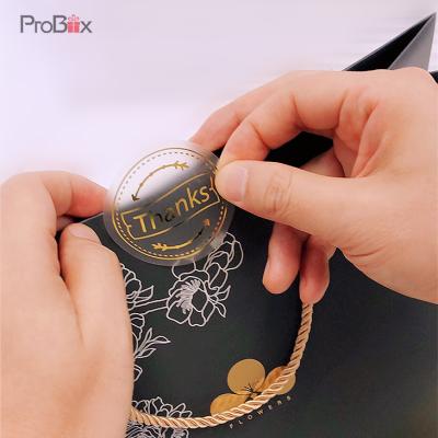 China Custom Hot Shiny Gold Waterproof Shiny Custom Hot Foil Christmas Sticker Label Paper Black Aluminum Foil Sticker for sale