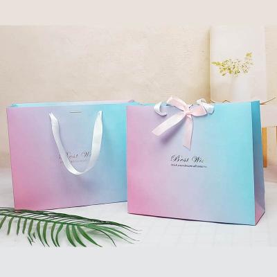 China Clothing Carry Reusable Shopping Packaging Recycled Luxury Logo Printed Luxury Custom MAC Cosmetic Carry Kraft Paper Bags for Shopping with Ribbon Handle for sale