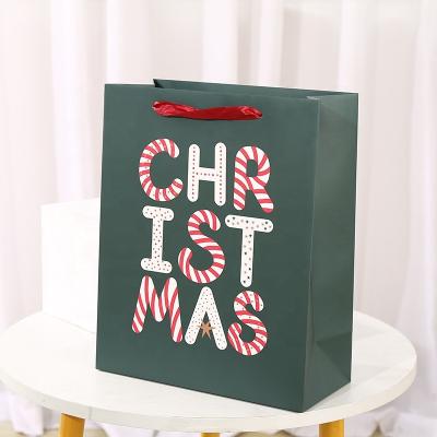 China Luxury Carry Shopping Packaging Christmas Party Decorative Paper Gift Bags For Christmas Custom Printed Wrapping Paper Pouch Bag With Handle for sale