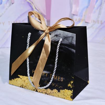 China Custom Made Luxury White Carry Paper Gift Packaging Reusable Shopping Packaging Cheap Small Brown Clothing Packaging Bags With Twisted Handles for sale