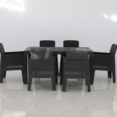 China Modern Rattan Patio Dining Dining Table And Plastic Garden Chair Set Set 7 Pcs for sale