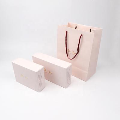 China Custom Recycled Paper Bag Gift Bag Wholesale Packaging Materials Shopping Clothing Packaging Box for sale