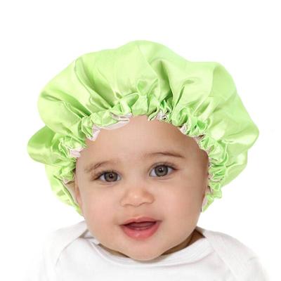 China Dobby Fashion Elastic Band Baby Shower Hat Boy Color Satin Reverse Sleep Hat for sale