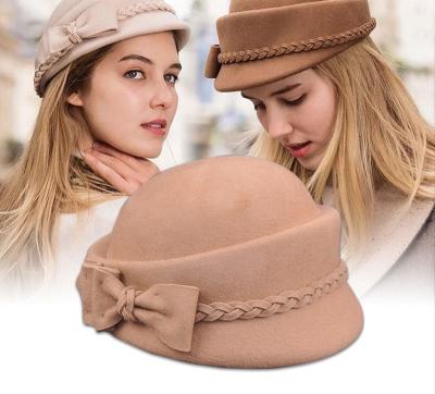 China Classy 2021 Autumn And Winter Vintage Plush Bow Woolen Beret Hostess Cap For Women for sale