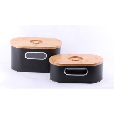 China Modern Black Sustainable 2-in-1 Bread Canister With Cutting Board Lid Metal Bread Bin Bamboo Food Canister for sale