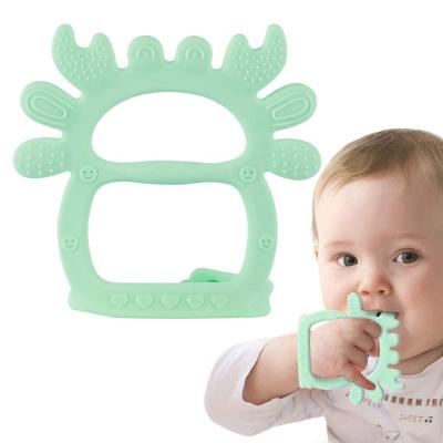 China Safety Silicone Poop Shape Brush Toys Adjustable Baby Ring Fruit Teethers for sale