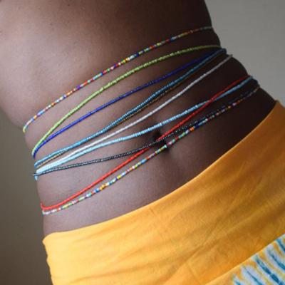 China TRENDY Drop Shipping Multicolor African Waist Beads Belly Chain Bohemian Style Body Jewelry Elastic Colorful Rice Bead Waist Chain for sale