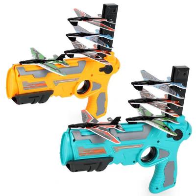 China Outdoor Toy Boys Hand Throwing Pirouette Foam Airplane Catapult Pistol Launcher for sale