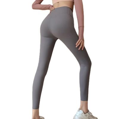 China 2022 breathable European and American nude yoga clothes women's waist high hip lifting tights running sports fitness ground quick dry pants for sale